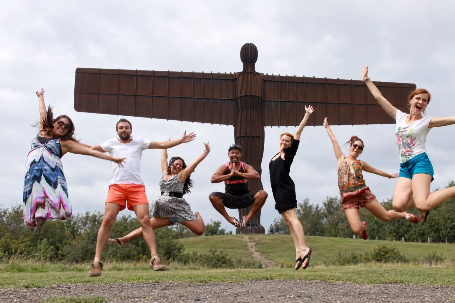 A group of young adults taking part in an international learning visit at the Angel of the North